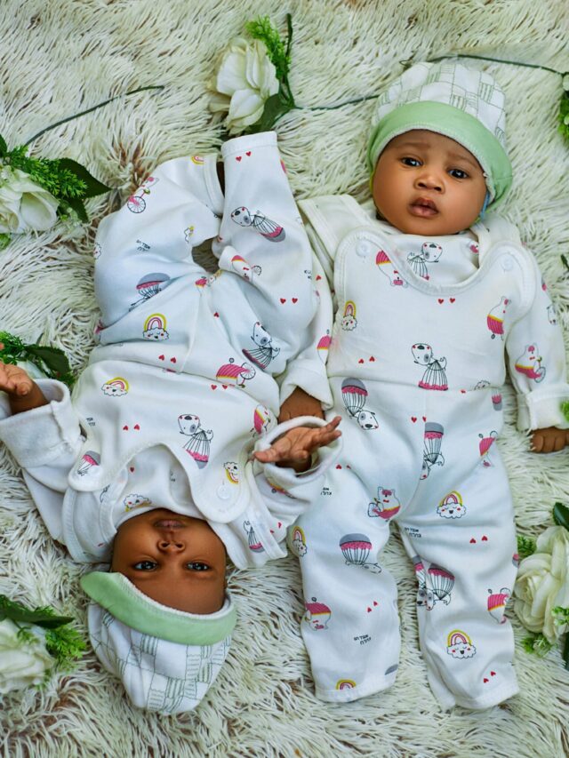 baby twins lying upside down next to each other